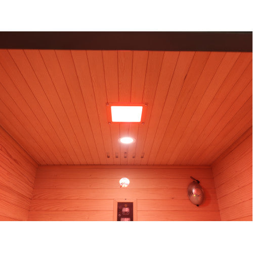 Wooden interior of a sauna with red lighting