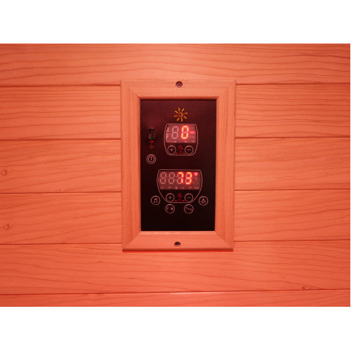 Wooden sauna wall with digital control panel displaying temperature and time.