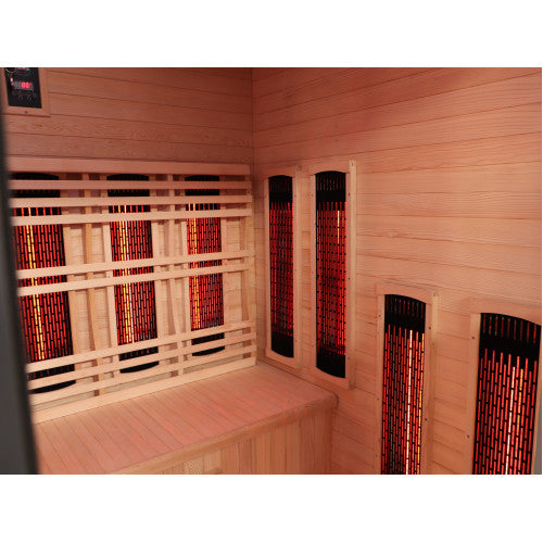 Infrared sauna with wooden walls and benches