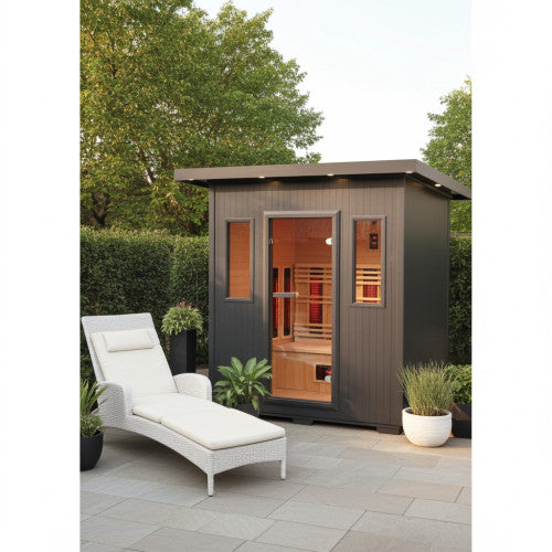 Outdoor sauna with a lounge chair in a garden setting