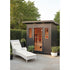 Outdoor sauna with a lounge chair in a garden setting