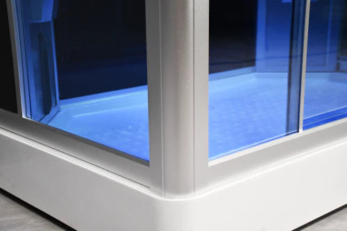 Corner of a modern glass-enclosed pool with white frame