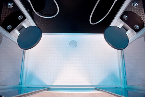 Close-up of a shower enclosure with glass walls and blue circular shower heads.