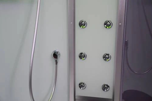 Close-up of a shower panel with multiple shower heads and control buttons.