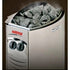A Harvia VEGA stone heater with gray heating stones visible inside, featuring a brushed silver metal body and red and black Harvia branding.