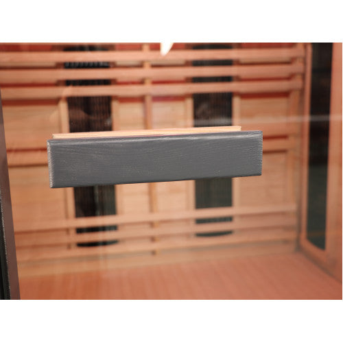 Metallic handle on a wooden door with a blurred background