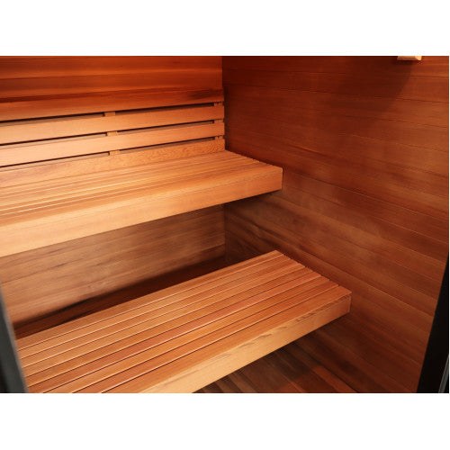 Close-up of a wooden sauna interior with slatted wooden benches and a wood-paneled wall.