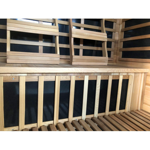 Wooden sauna with black interior panels