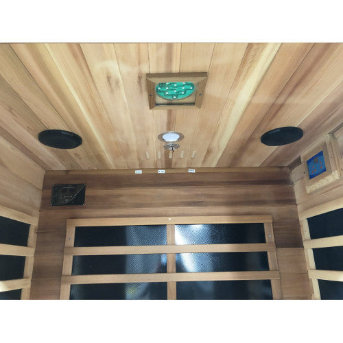 Wooden sauna interior with ceiling lights and glass panels.