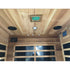 Wooden sauna interior with ceiling lights and glass panels.