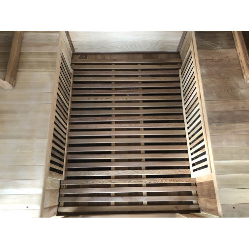 Wooden sauna with slatted door