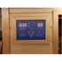 Digital control panel with temperature display on a wooden sauna door