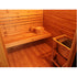 Wooden sauna interior with a bench, bucket, and heater.