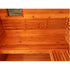 Wooden sauna interior with benches and a mirror.