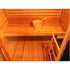 Wooden sauna interior with a bucket and wooden spoon.